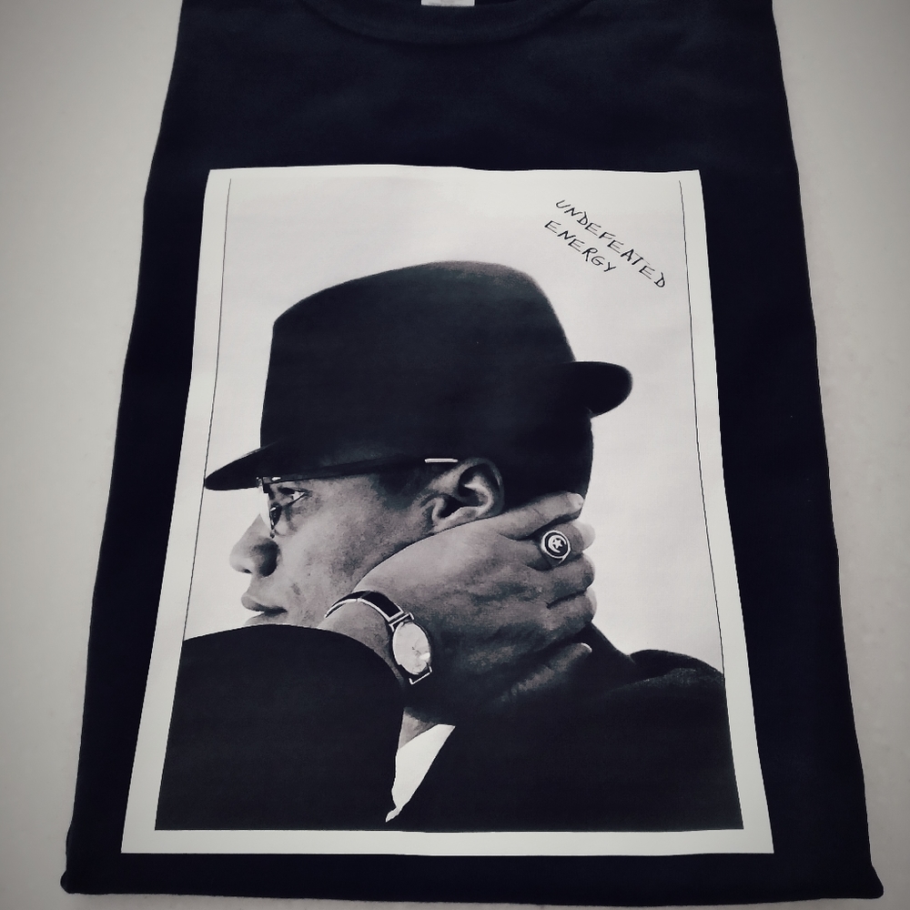UNDEFEATED ENERGY tee featuring Malcom X